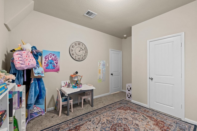 game room with carpet flooring, a textured ceiling, baseboards, and visible vents