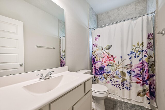 13710 Alaskan Brown Bear Trl, Crosby, TX 77532 - bathroom featuring shower / bath combo, toilet, and vanity