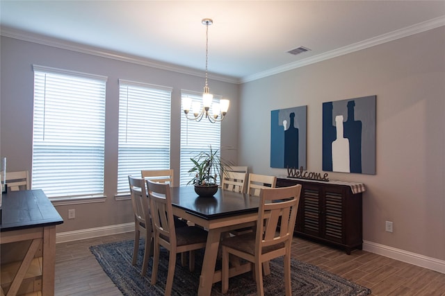 1627 Carriage Oaks Ln, Katy, TX 77494 - dining space featuring visible vents, baseboards, an inviting chandelier, and wood finished floors