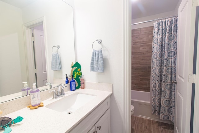 1627 Carriage Oaks Ln, Katy, TX 77494 - full bath featuring toilet, wood finished floors, vanity, and shower / bathtub combination with curtain