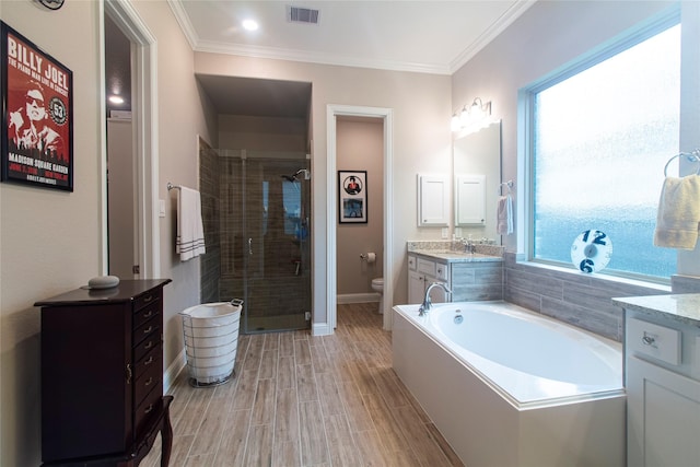 1627 Carriage Oaks Ln, Katy, TX 77494 - bathroom featuring vanity, toilet, a shower stall, visible vents, and a garden tub