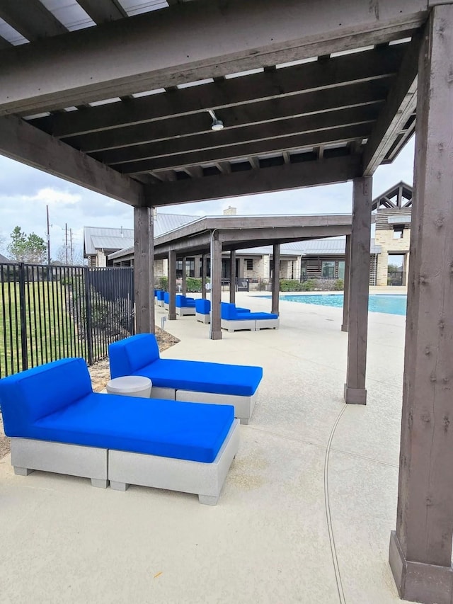 1627 Carriage Oaks Ln, Katy, TX 77494 - view of patio with a community pool and fence