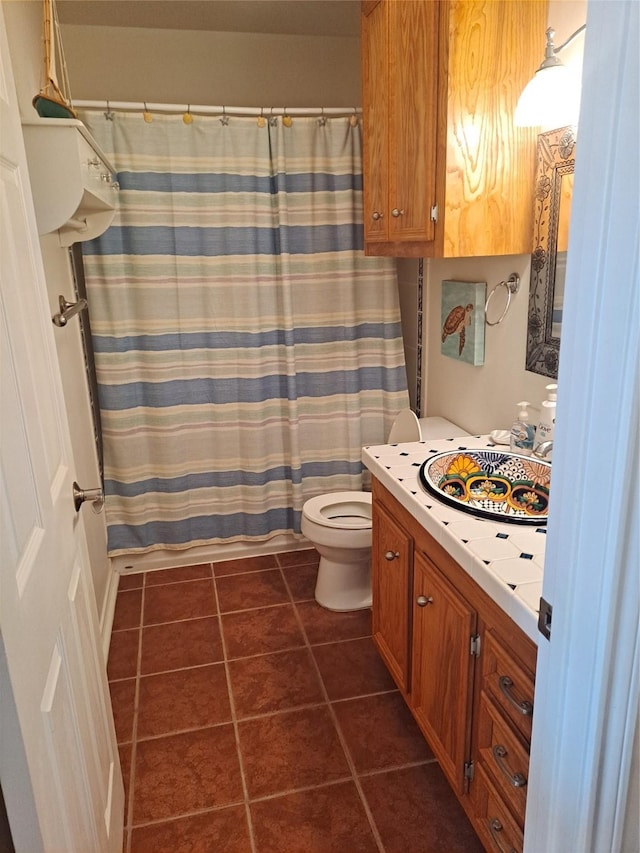 full bath with tile patterned floors, vanity, toilet, and a shower with shower curtain