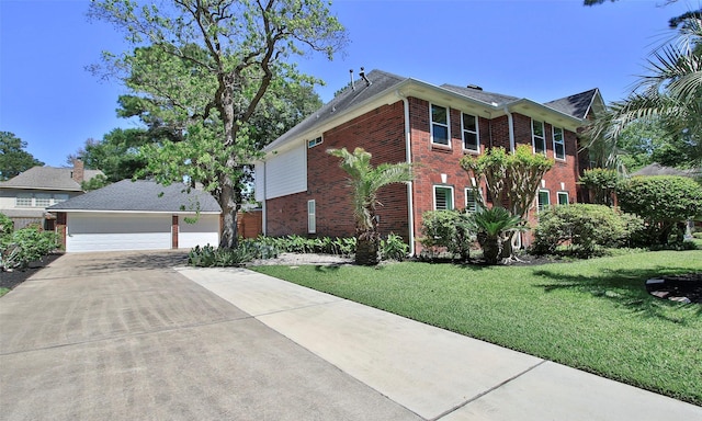 12510 Beauline Abbey St, Tomball, TX 77377 - colonial inspired home with a garage, brick siding, and a front yard