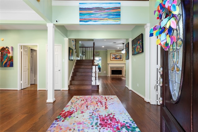 12510 Beauline Abbey St, Tomball, TX 77377 - entryway featuring a fireplace, hardwood / wood-style flooring, stairs, and baseboards