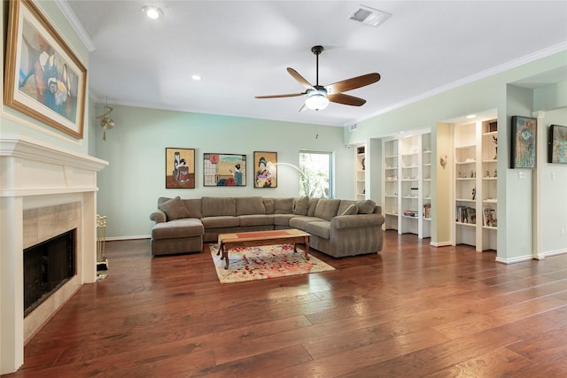 12510 Beauline Abbey St, Tomball, TX 77377 - living area featuring a ceiling fan, hardwood / wood-style floors, crown molding, visible vents, and a high end fireplace
