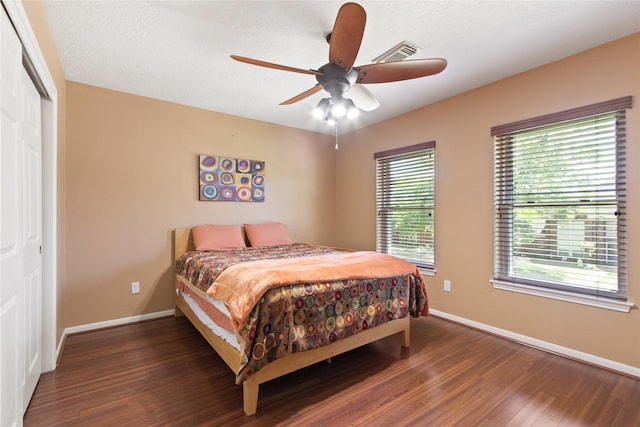 12510 Beauline Abbey St, Tomball, TX 77377 - bedroom with baseboards, visible vents, and wood finished floors