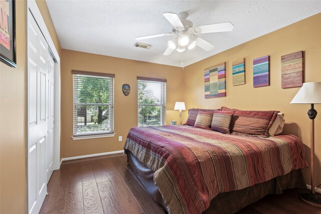 12510 Beauline Abbey St, Tomball, TX 77377 - bedroom with a closet, visible vents, baseboards, and hardwood / wood-style floors