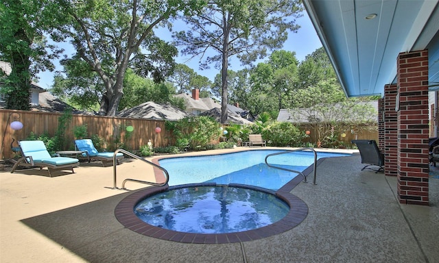 12510 Beauline Abbey St, Tomball, TX 77377 - view of swimming pool with a pool with connected hot tub, a patio, and a fenced backyard