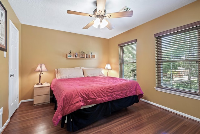 12510 Beauline Abbey St, Tomball, TX 77377 - bedroom with baseboards, ceiling fan, visible vents, and wood finished floors