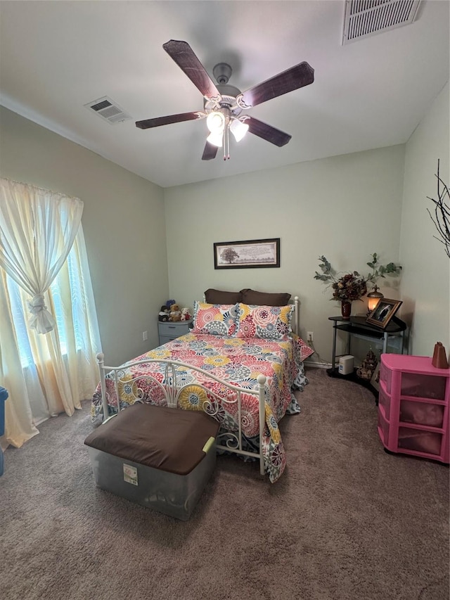 208 County Road 308, Cleveland, TX 77327 - carpeted bedroom featuring visible vents and ceiling fan
