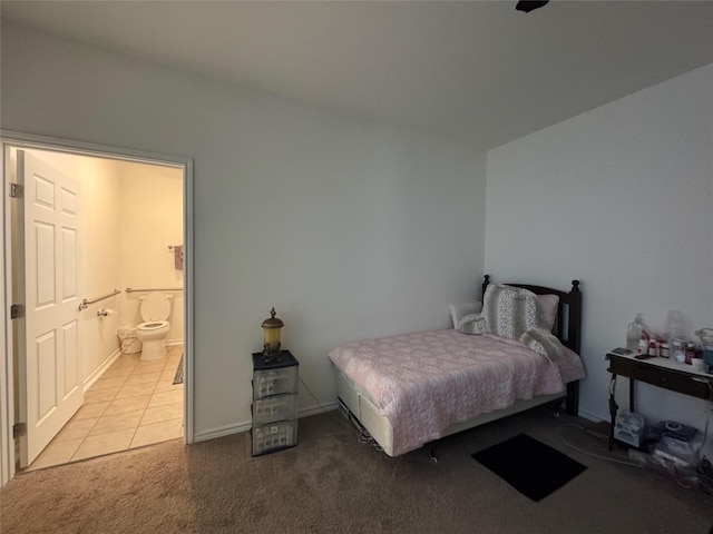 208 County Road 308, Cleveland, TX 77327 - carpeted bedroom featuring tile patterned flooring and ensuite bathroom