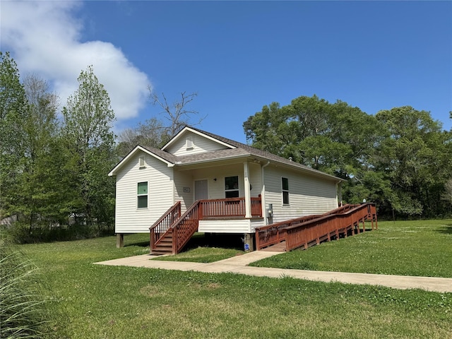 208 County Road 308, Cleveland, TX 77327 - bungalow-style house featuring a front lawn and a wooden deck