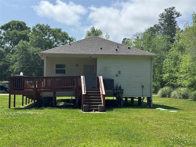 208 County Road 308, Cleveland, TX 77327 - back of house with central air condition unit, stairway, a deck, a shingled roof, and a yard