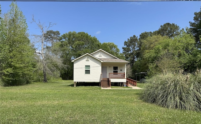 208 County Road 308, Cleveland, TX 77327 - rear view of property featuring a shingled roof and a yard