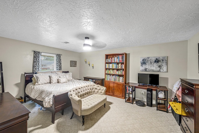 3102 Blue Hills Dr, Missouri City, TX 77459 - carpeted bedroom featuring a ceiling fan, a textured ceiling, and visible vents