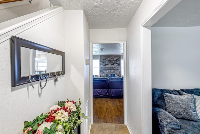 3102 Blue Hills Dr, Missouri City, TX 77459 - hall featuring a textured ceiling