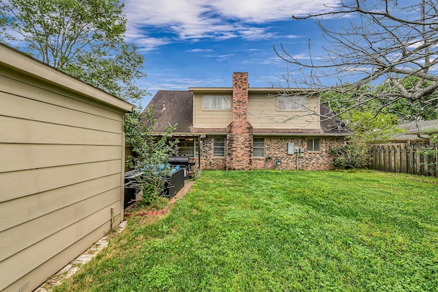 3102 Blue Hills Dr, Missouri City, TX 77459 - rear view of house with fence and a yard