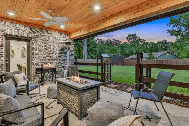 2711 Constantine St, New Caney, TX 77357 - view of patio featuring a trampoline, a fire pit, and a ceiling fan