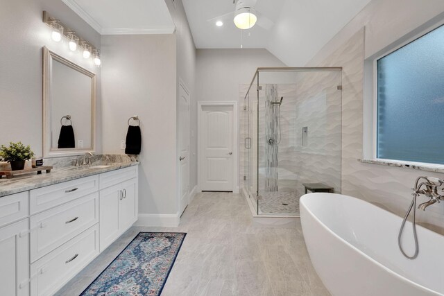 2711 Constantine St, New Caney, TX 77357 - full bath featuring ceiling fan, a shower stall, a freestanding bath, vanity, and lofted ceiling