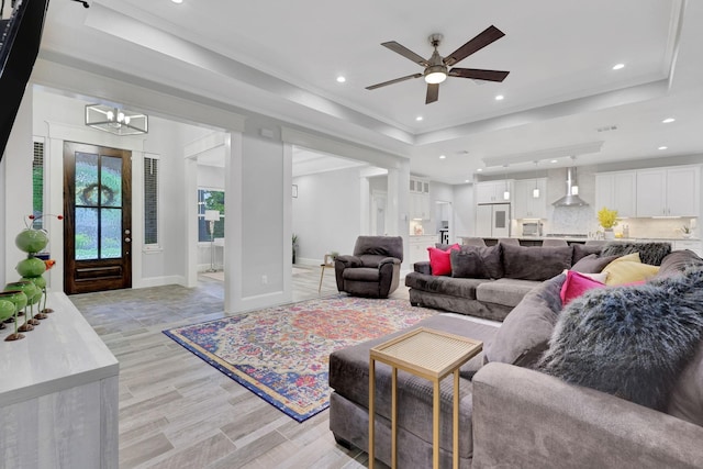 2711 Constantine St, New Caney, TX 77357 - living area with ceiling fan, recessed lighting, a chandelier, baseboards, and a raised ceiling