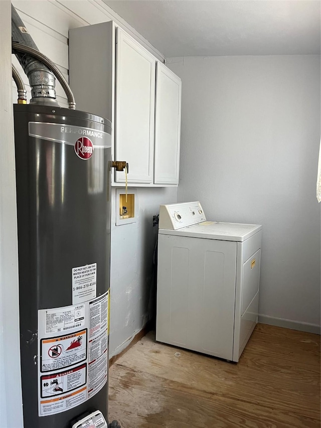 2044 Thonig Rd, Houston, TX 77055 - washroom with washer / clothes dryer, water heater, cabinet space, light wood-style flooring, and baseboards