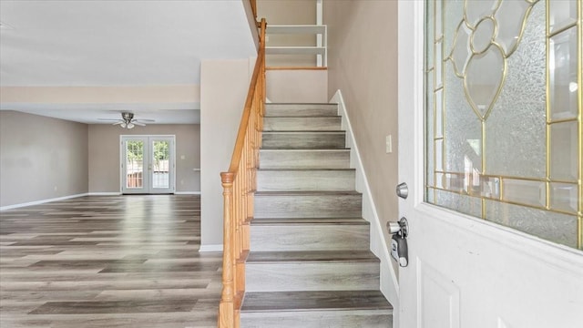 1302 20th St, Huntsville, TX 77340 - stairs featuring wood finished floors, a ceiling fan, and baseboards