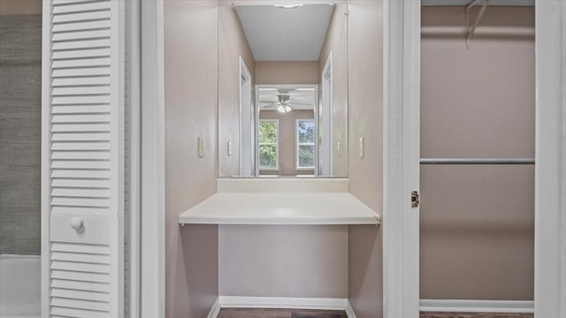 1302 20th St, Huntsville, TX 77340 - bathroom with a ceiling fan and baseboards