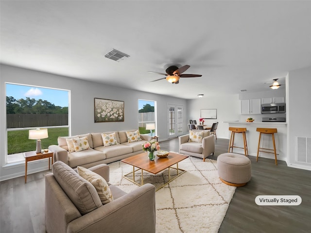 19431 Cypress Royal Dr, Katy, TX 77449 - living area featuring wood finished floors, healthy amount of natural light, ceiling fan, and baseboards