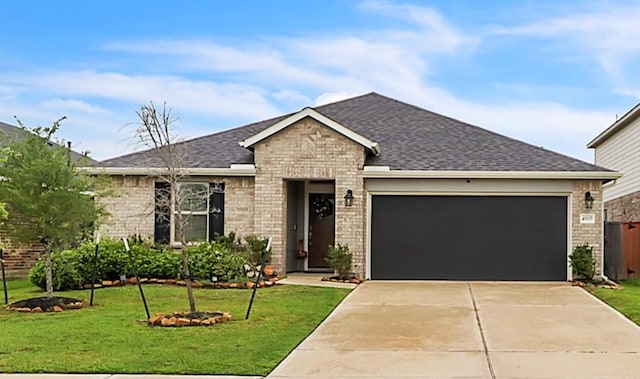 4507 Red Yucca Dr, Baytown, TX 77521 - ranch-style house featuring driveway, a front yard, roof with shingles, brick siding, and a garage