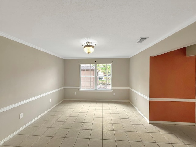 unfurnished room with crown molding, light tile patterned floors, baseboards, a textured ceiling, and visible vents
