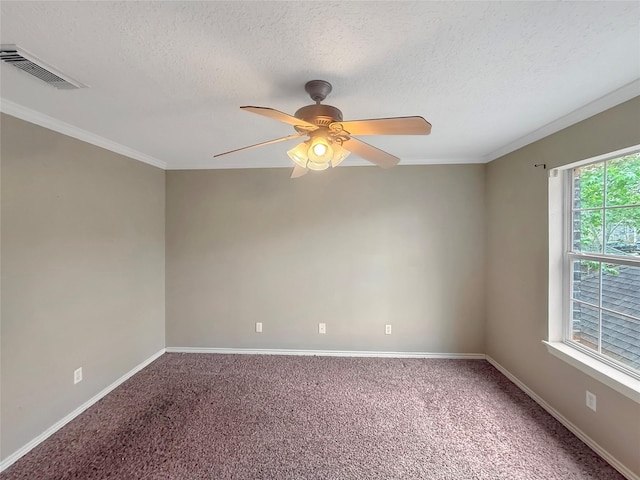 unfurnished room with baseboards, visible vents, carpet, and a ceiling fan