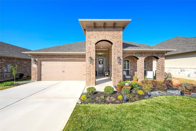 5314 Tribolo Trl, Round Rock, TX 78665 - view of front of property featuring driveway, a shingled roof, an attached garage, and brick siding