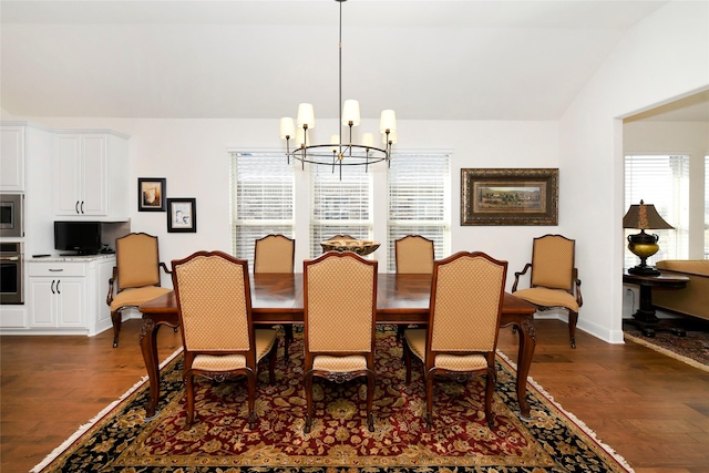 5314 Tribolo Trl, Round Rock, TX 78665 - dining area featuring dark wood-style floors, lofted ceiling, a chandelier, and baseboards