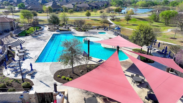 5314 Tribolo Trl, Round Rock, TX 78665 - pool featuring a community hot tub, a water view, fence, and a patio