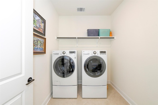 5314 Tribolo Trl, Round Rock, TX 78665 - washroom with light tile patterned flooring, independent washer and dryer, visible vents, baseboards, and laundry area