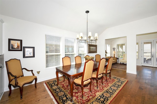 5314 Tribolo Trl, Round Rock, TX 78665 - dining space with a notable chandelier, dark wood-style floors, lofted ceiling, and baseboards