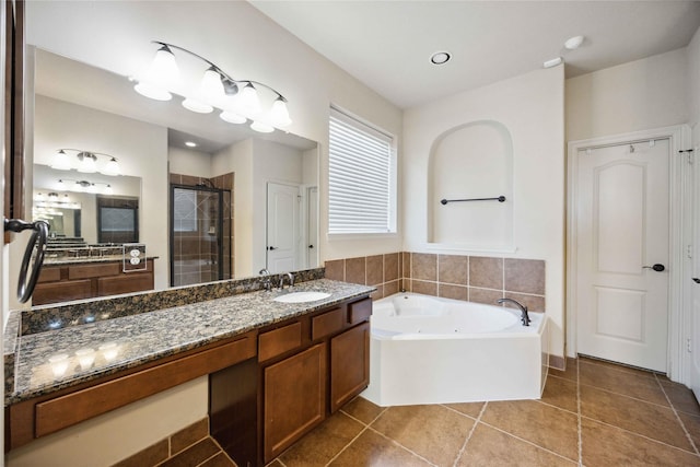 2210 Pearl Bay Ct, Pearland, TX 77584 - bathroom with tile patterned floors, a stall shower, a jetted tub, and vanity