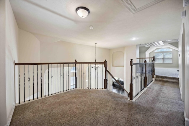 2210 Pearl Bay Ct, Pearland, TX 77584 - hall featuring carpet, lofted ceiling, baseboards, and a chandelier