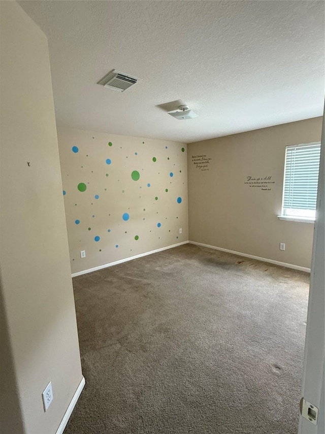 3307 Manor Tree Ln SW, Houston, TX 77068 - carpeted spare room featuring baseboards and a textured ceiling