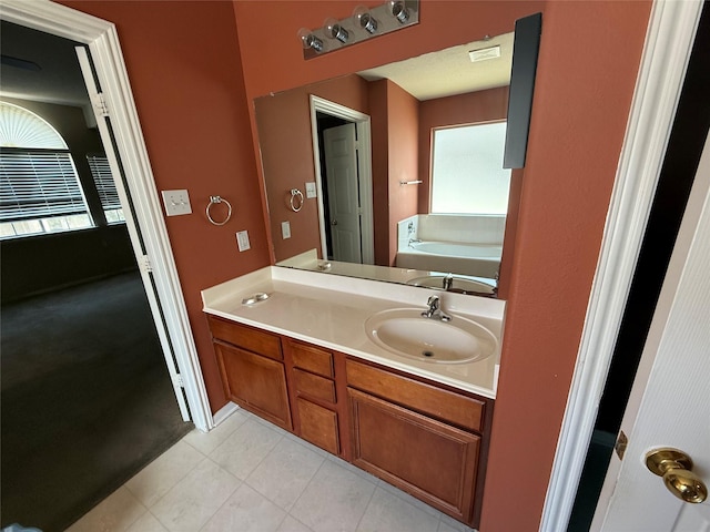 3307 Manor Tree Ln SW, Houston, TX 77068 - bathroom featuring vanity, tile patterned flooring, and a bath