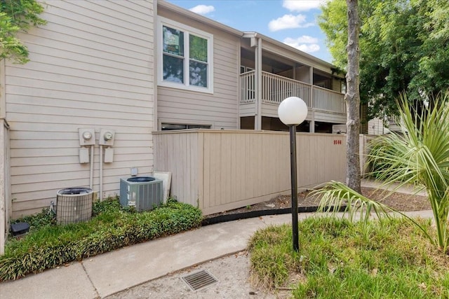 9566 Windswept Ln Unit 9566, Houston, TX 77063 - view of side of home featuring central AC