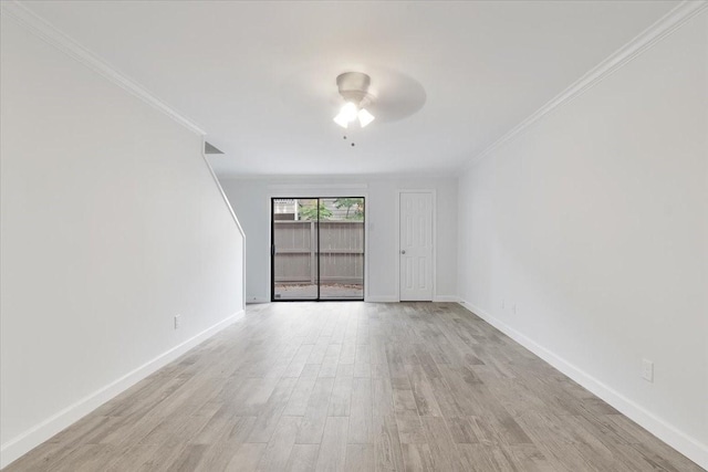 9566 Windswept Ln Unit 9566, Houston, TX 77063 - spare room featuring ornamental molding, a ceiling fan, and light wood-style flooring