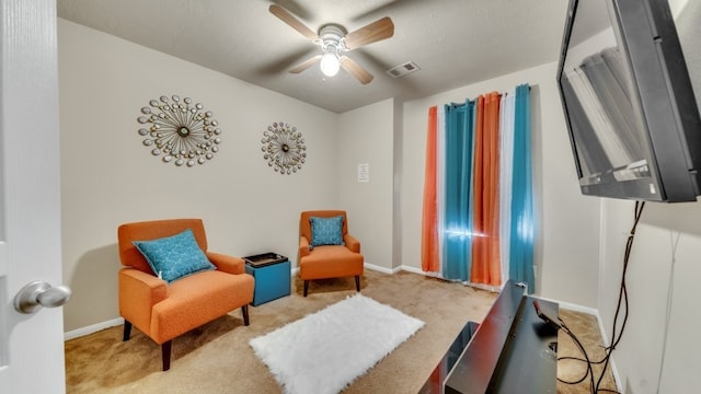 2201 Moonstone Ct, Texas City, TX 77591 - living area with carpet floors, baseboards, and a ceiling fan