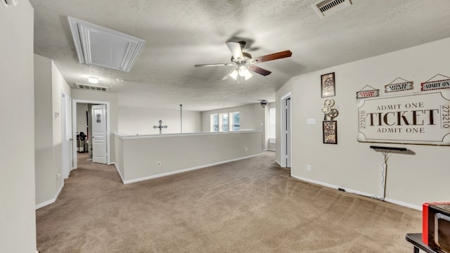2201 Moonstone Ct, Texas City, TX 77591 - unfurnished living room with attic access, carpet flooring, a ceiling fan, and baseboards