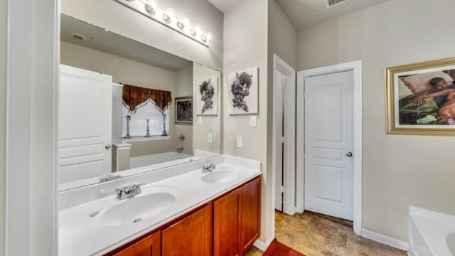 2201 Moonstone Ct, Texas City, TX 77591 - full bath featuring a garden tub, double vanity, and baseboards
