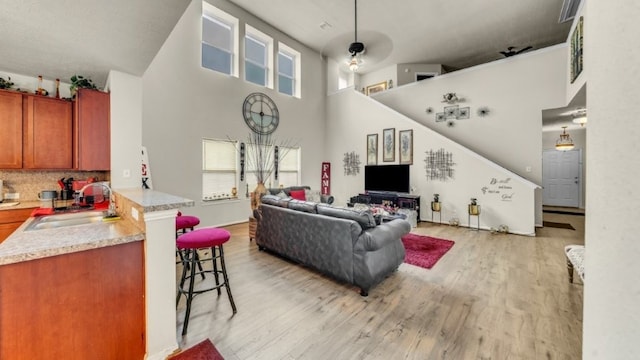 2201 Moonstone Ct, Texas City, TX 77591 - living room featuring a high ceiling and light wood finished floors