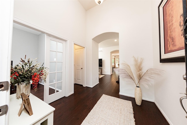6014 Barrett Cove Ct, Richmond, TX 77407 - hall with a towering ceiling, arched walkways, baseboards, and dark wood-type flooring