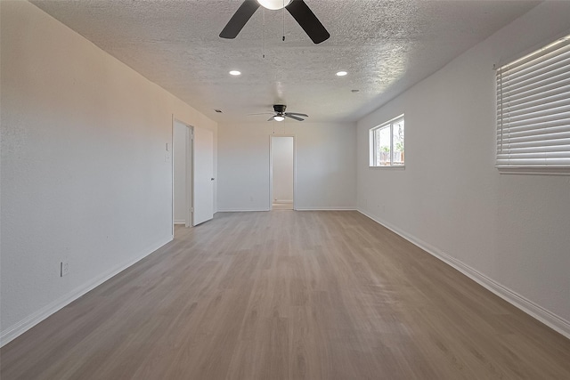 6219 Canada Dr, Pasadena, TX 77505 - spare room with a ceiling fan, baseboards, light wood finished floors, and a textured ceiling