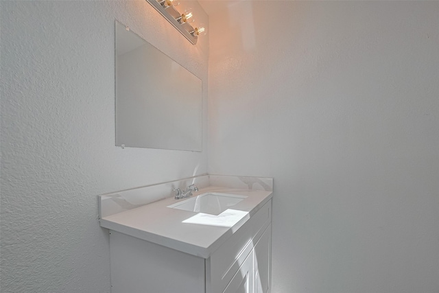 6219 Canada Dr, Pasadena, TX 77505 - bathroom with vanity and a textured wall